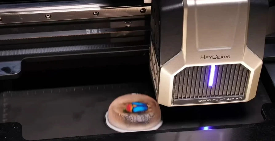 HeyGears G1X 3D Edition I3200 printhead producing a colorful 3D model layer by layer during the printing process.