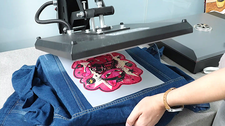 Heat pressing a full-color DTF transfer onto denim fabric to create a custom apparel design with HeyGears G1X.