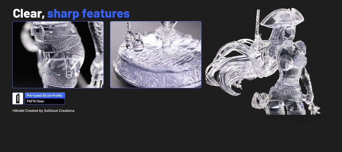 Transparent female miniature printed with HeyGears PAF10 Clear resin, showing sharp costume details and a clear surface finish.