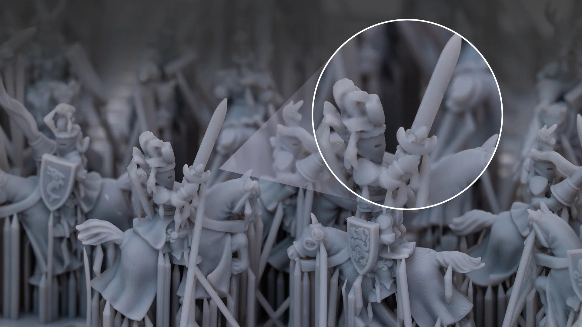 Batch of tabletop miniatures printed with HeyGears PAP10 resin, showing detailed figures and supports for high-volume miniature production.
