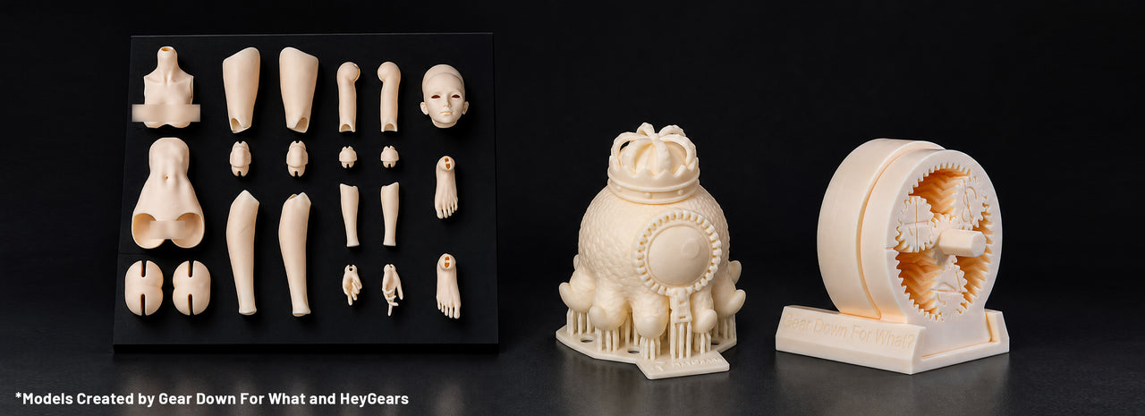 PAWR10 resin 3D printed articulated doll parts, a supported creature model and a working gear assembly on a black background.
